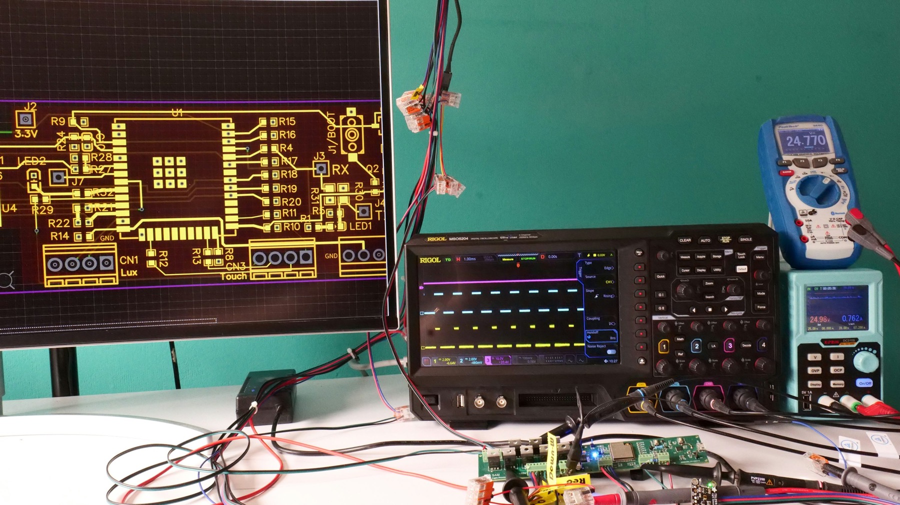 Modern oscilloscope, electronic measurement equipment and circuit board, illustrative stock photograph